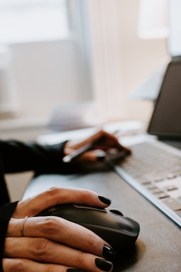 person using black and silver laptop computer