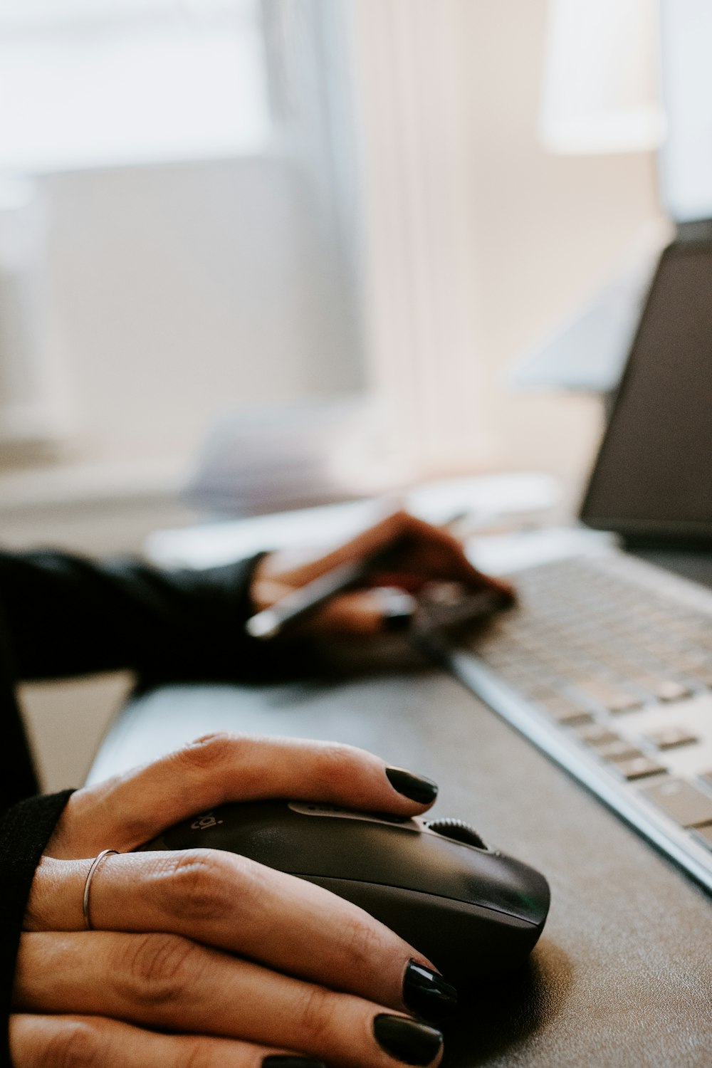 person using black and silver laptop computer