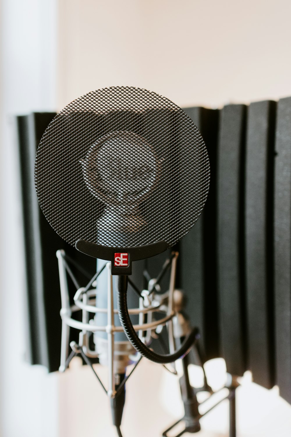 grey round fan on grey metal stand