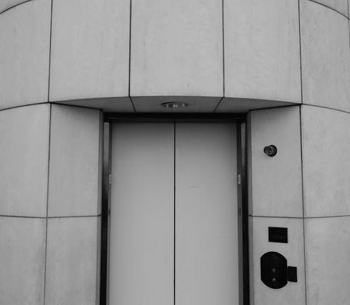 white wooden door with black door lever