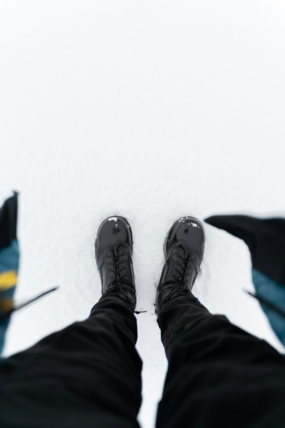 person wearing black and white nike sneakers