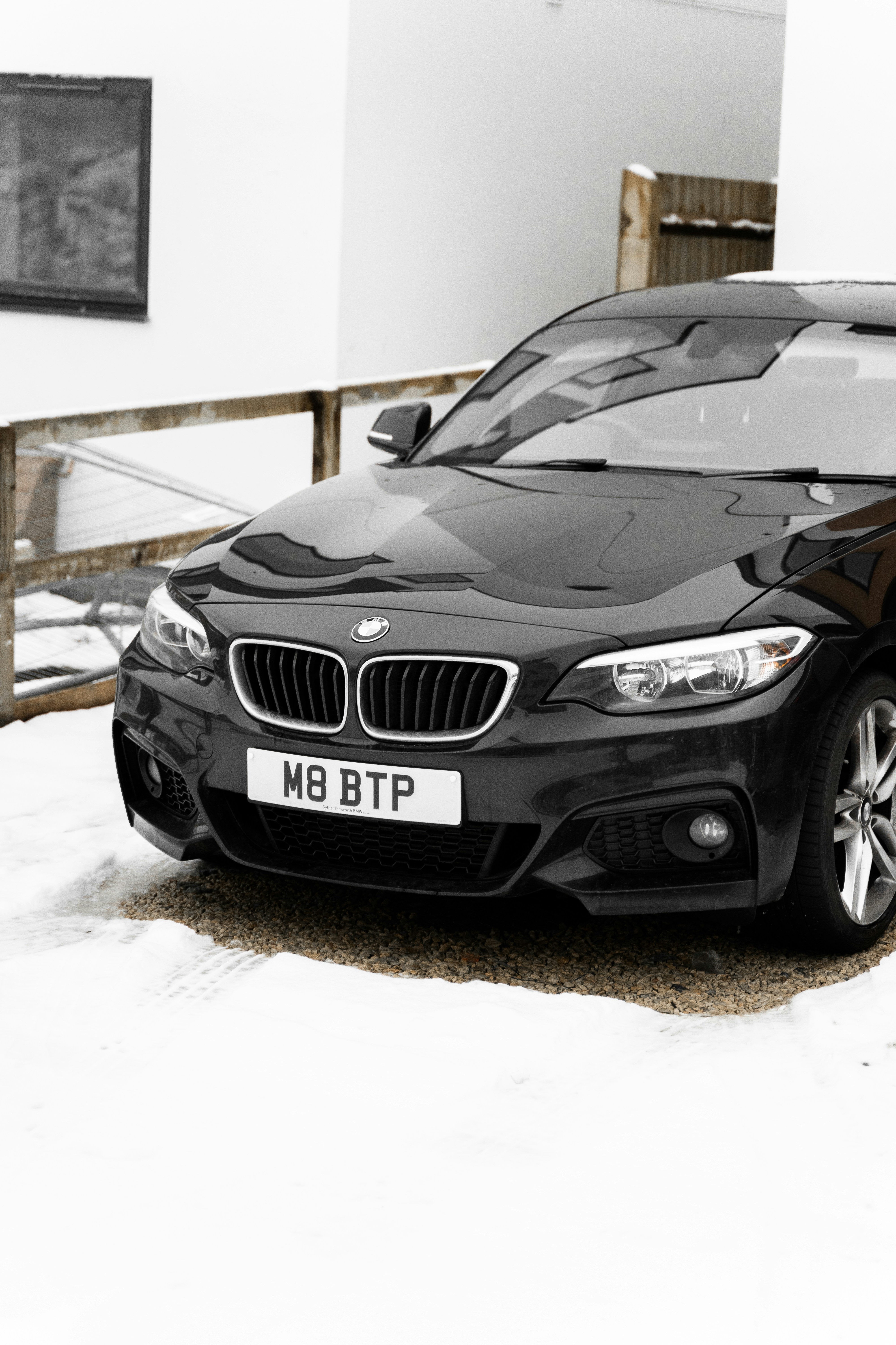 black mercedes benz c class on snow covered ground during daytime