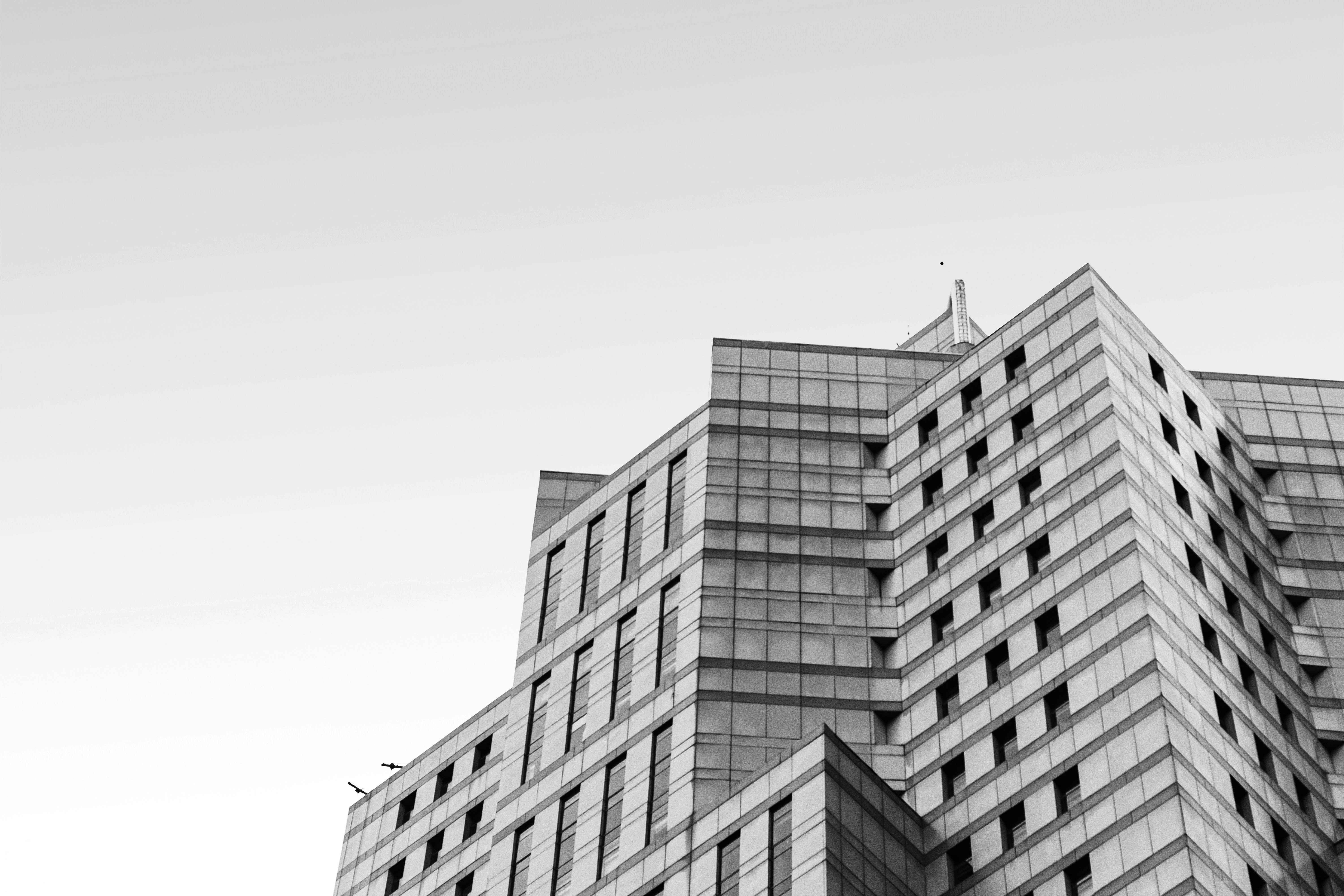 grayscale photo of high rise building