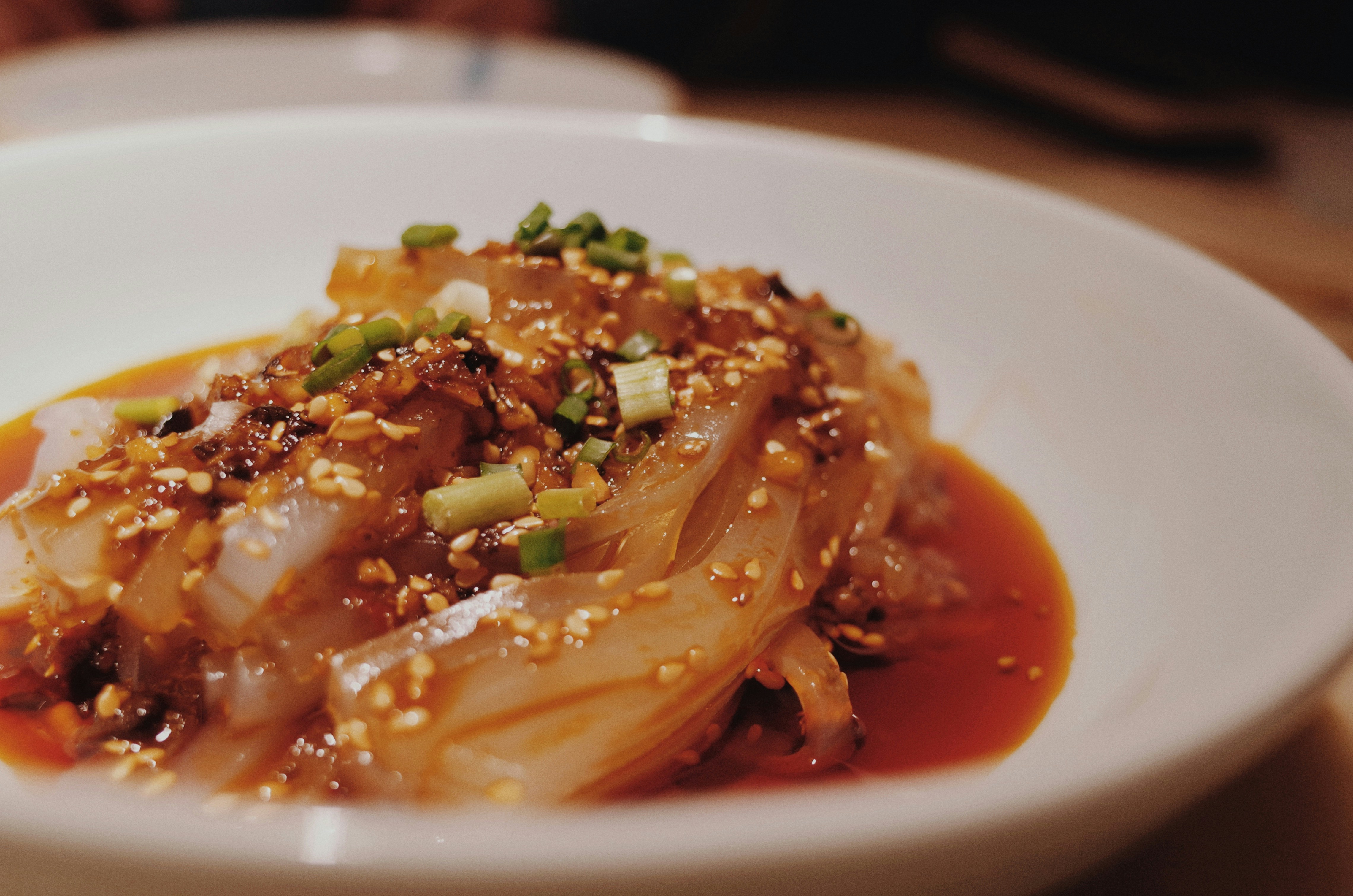 pasta with green leaf on white ceramic plate