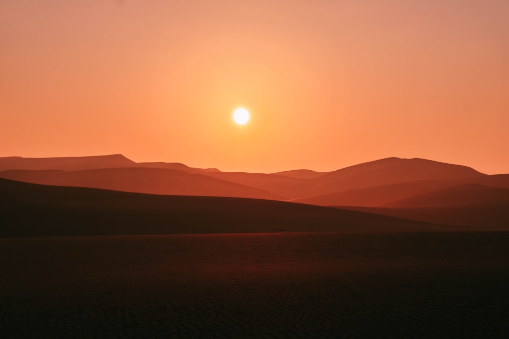 silhouette of mountains during sunset