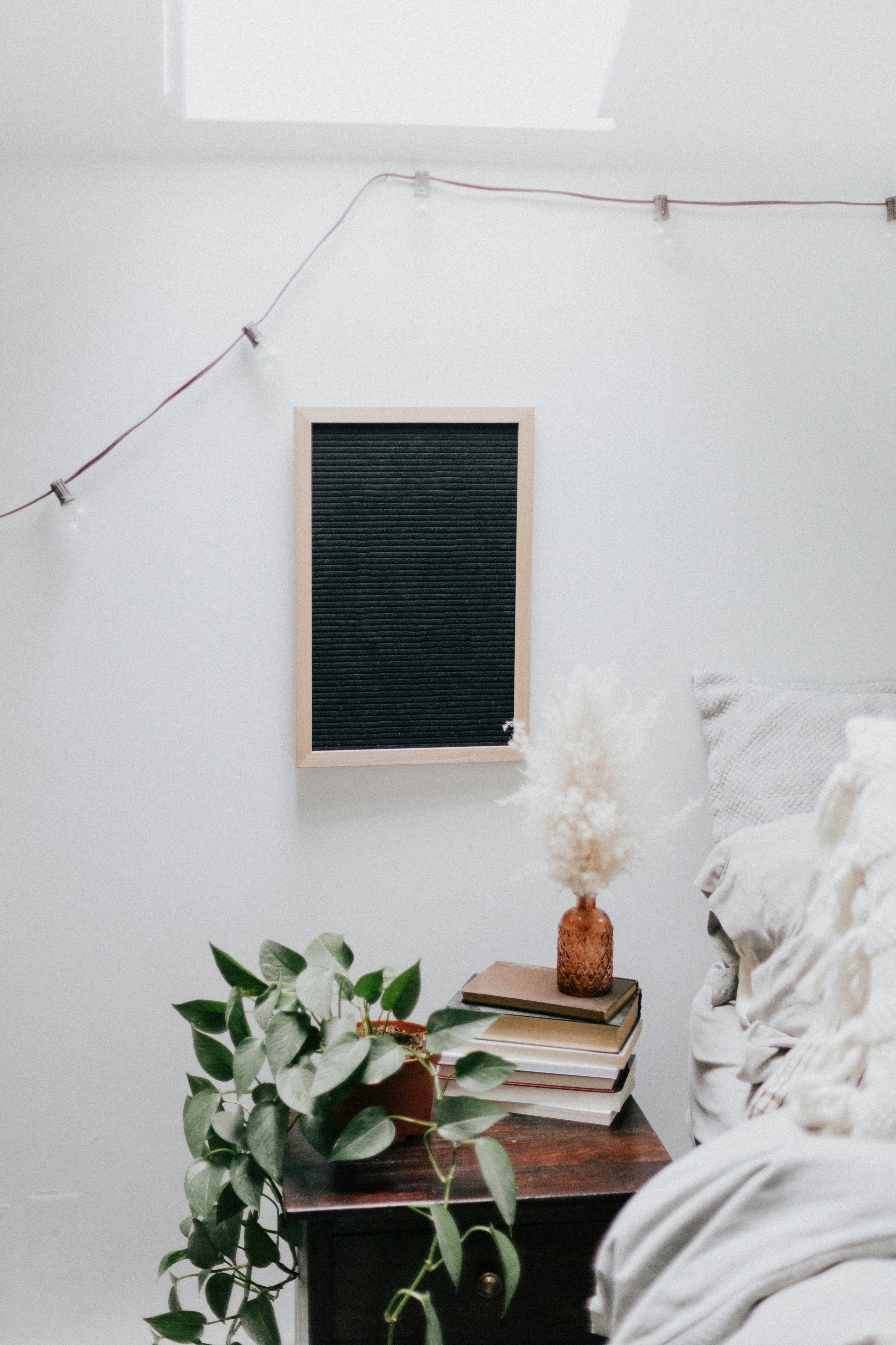 brown wooden rectangular frame on white wall