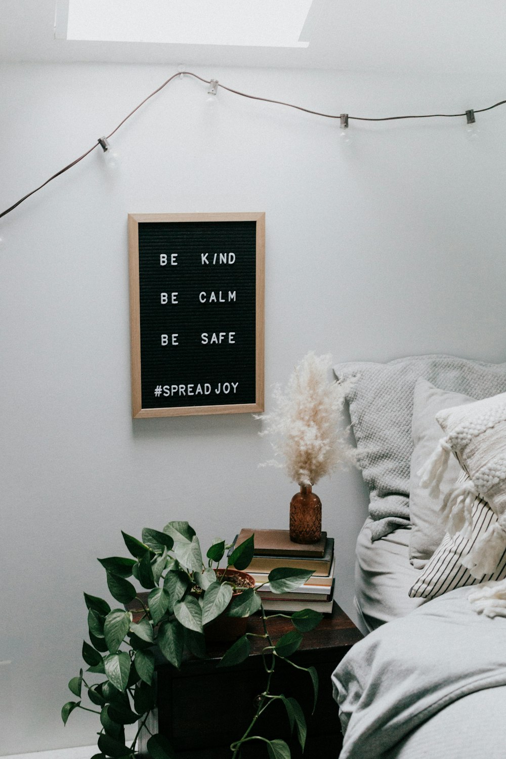 black and white quote board mounted on white wall