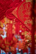 Close-up of traditional Chinese New Year decorations hanging on a door.