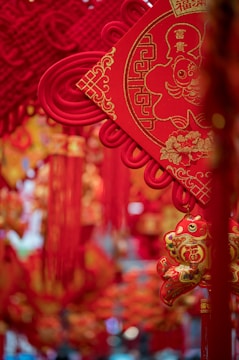 Close-up of traditional Chinese New Year decorations hanging on a door.