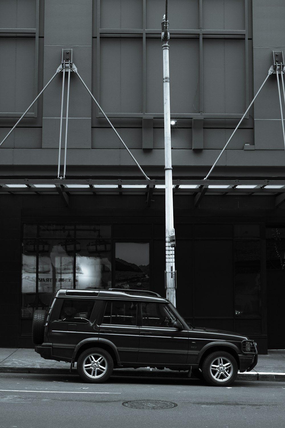 black car parked in front of building