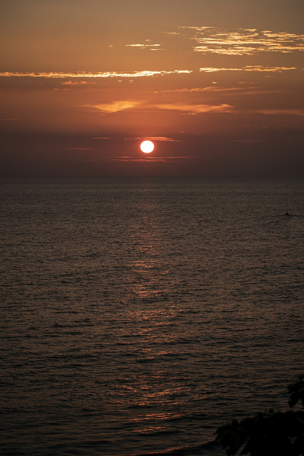 body of water during sunset