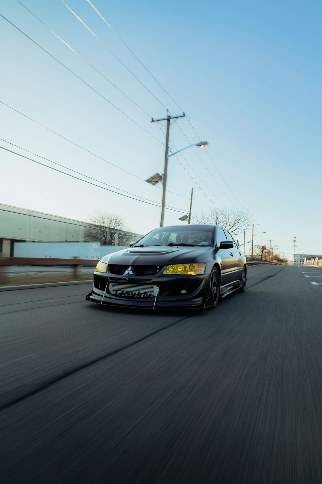 black bmw car on road during daytime