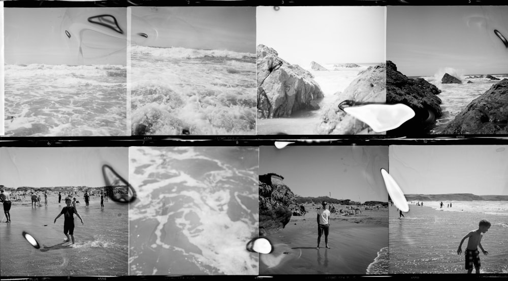 grayscale photo of man standing on rock formation near body of water