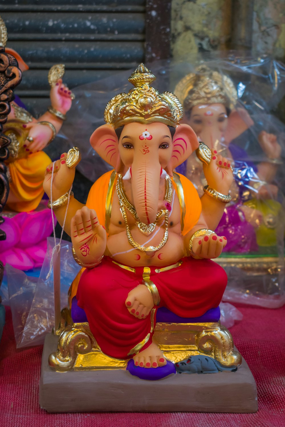 gold hindu deity figurine on table