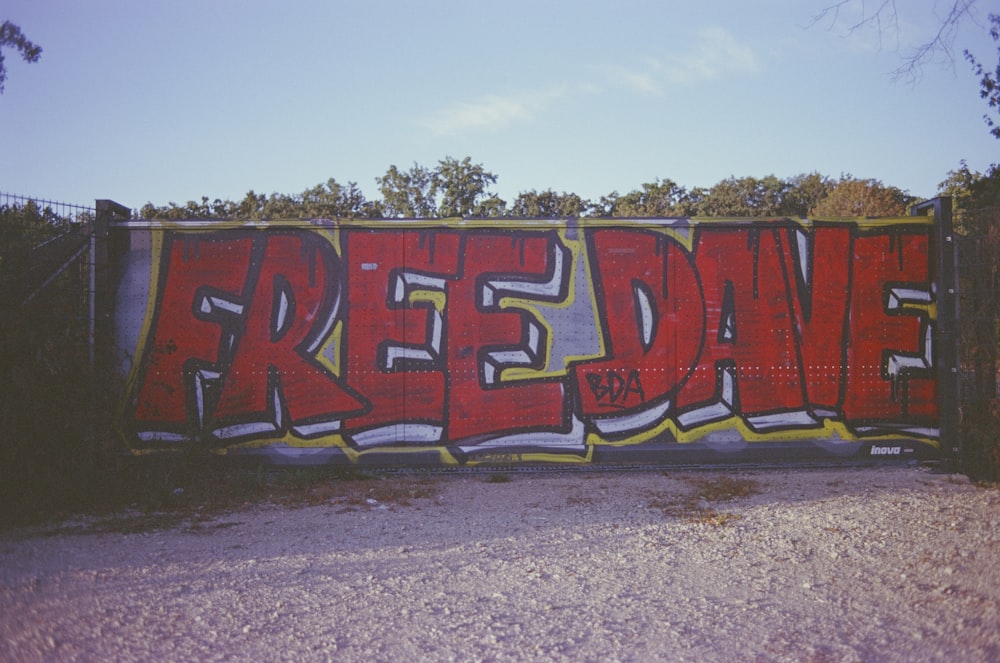 red and yellow graffiti on wall