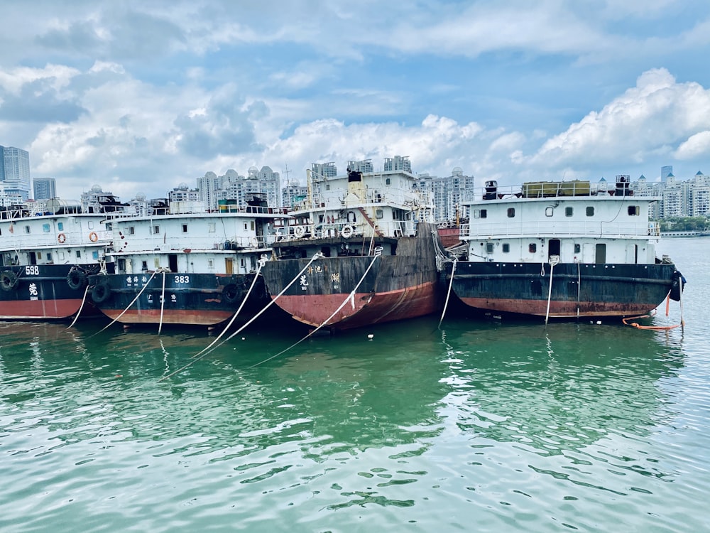 brown and white boat on water during daytime