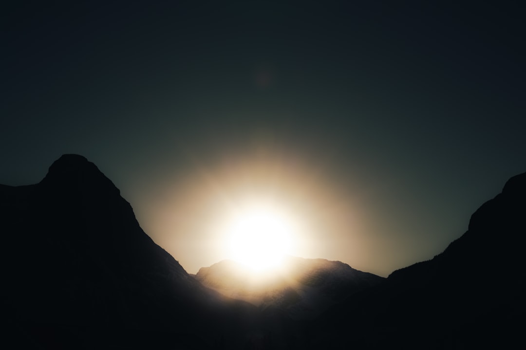 sun over the mountain during daytime