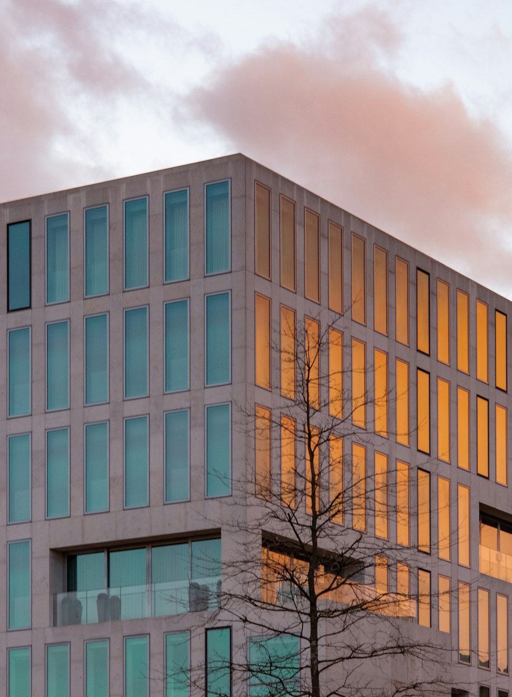 brown concrete building under cloudy sky during daytime