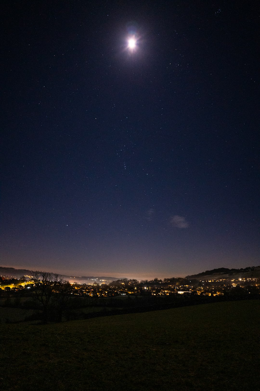 city lights turned on during night time