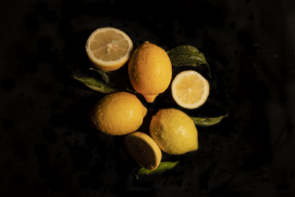 sliced orange fruit on black surface