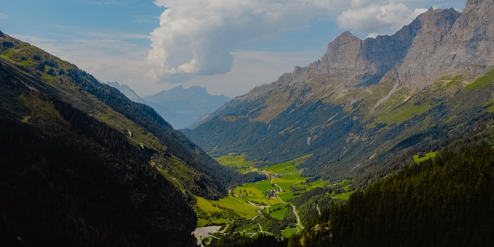 green mountains under white clouds during daytime