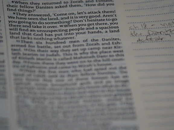 Close-up of an ancient manuscript with detailed illustrations and handwritten notes.