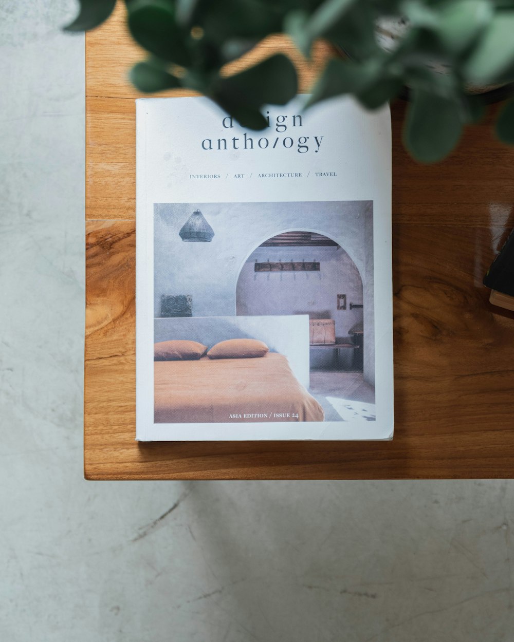 a magazine sitting on top of a wooden table