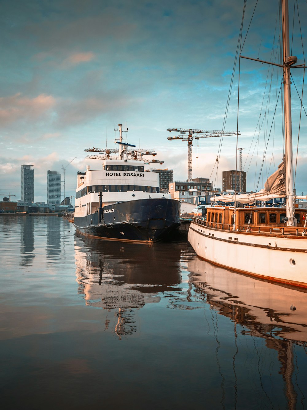 white and brown boat on water during daytime