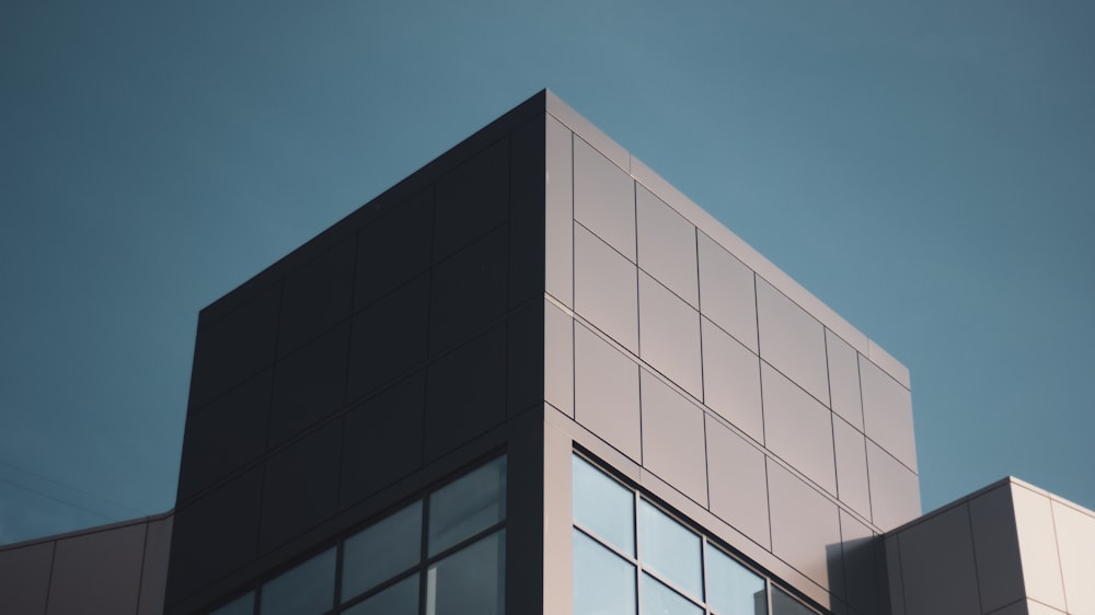 white and black concrete building under blue sky during daytime