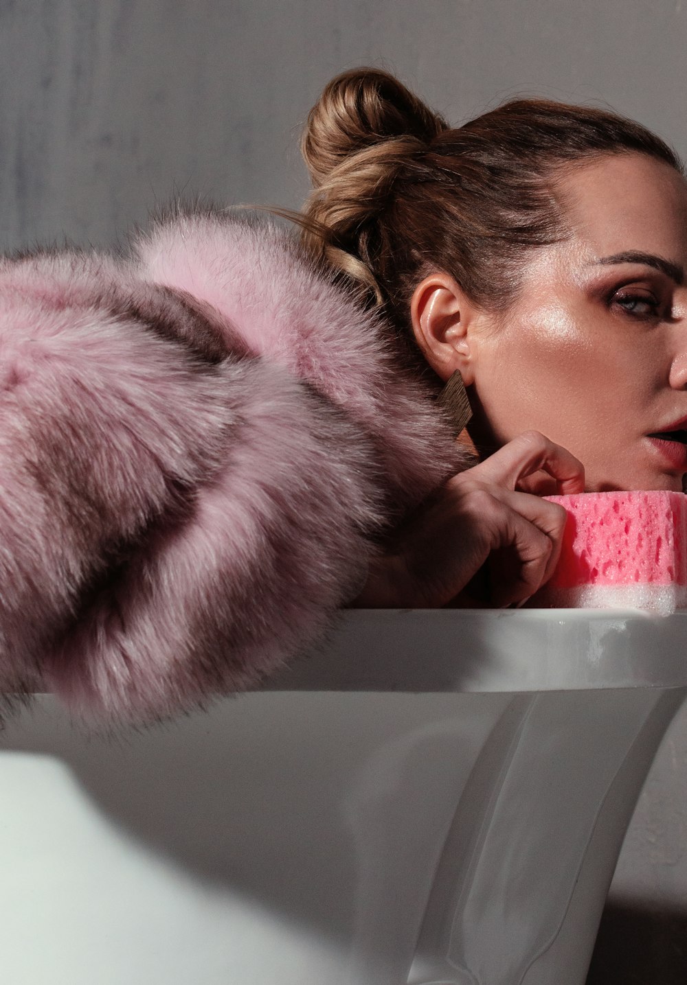 woman in pink fur coat