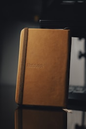 brown book on white table
