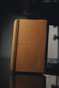 brown book on white table