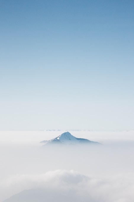 snow covered mountain under blue sky during daytime
