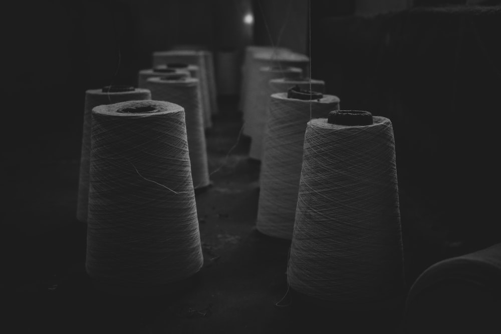 grayscale photo of rolled paper
