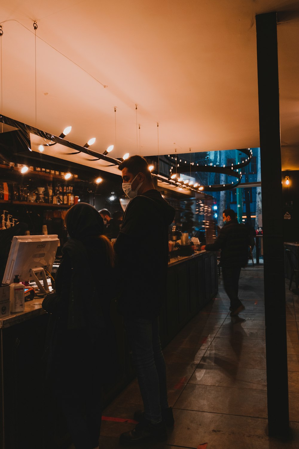 people standing in front of store