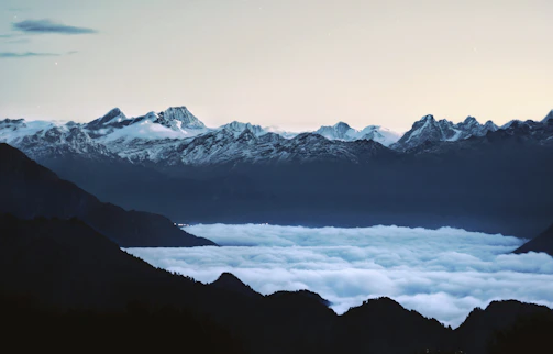 A serene sunrise view over the snow-capped Kedarnath temple nestled in the Himalayas.