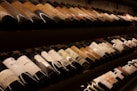 black and white bottles on brown wooden shelf