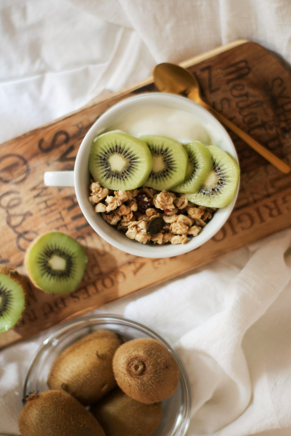 green and white ceramic mug on white and brown wooden table