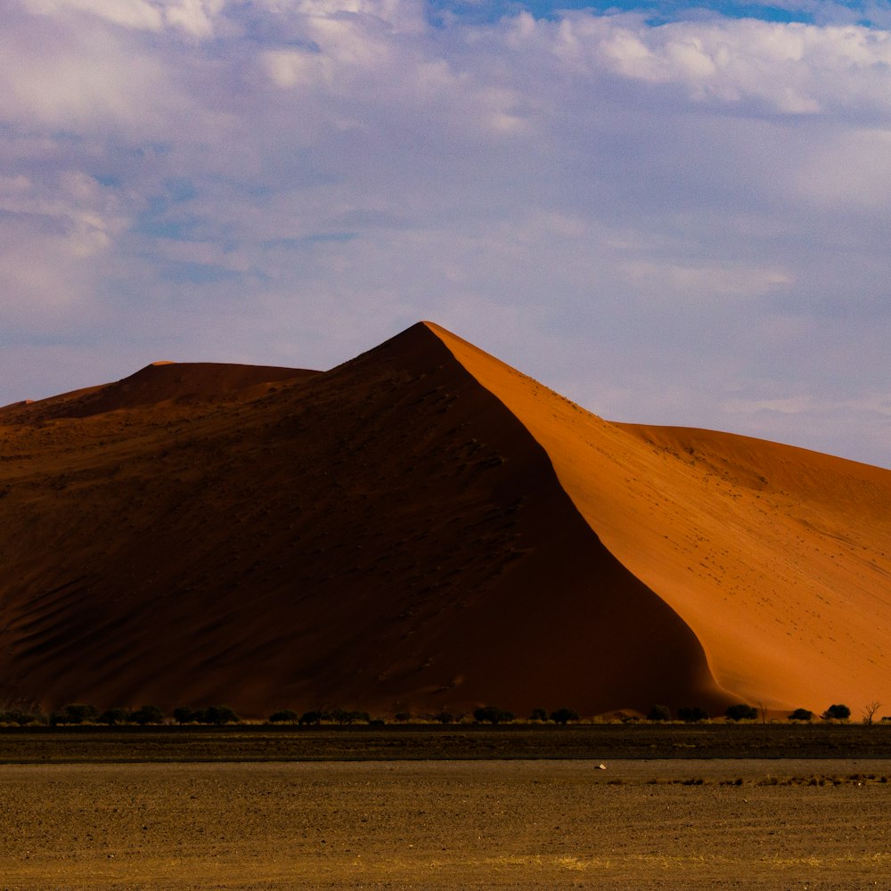 brown mountain under blue sky during daytime