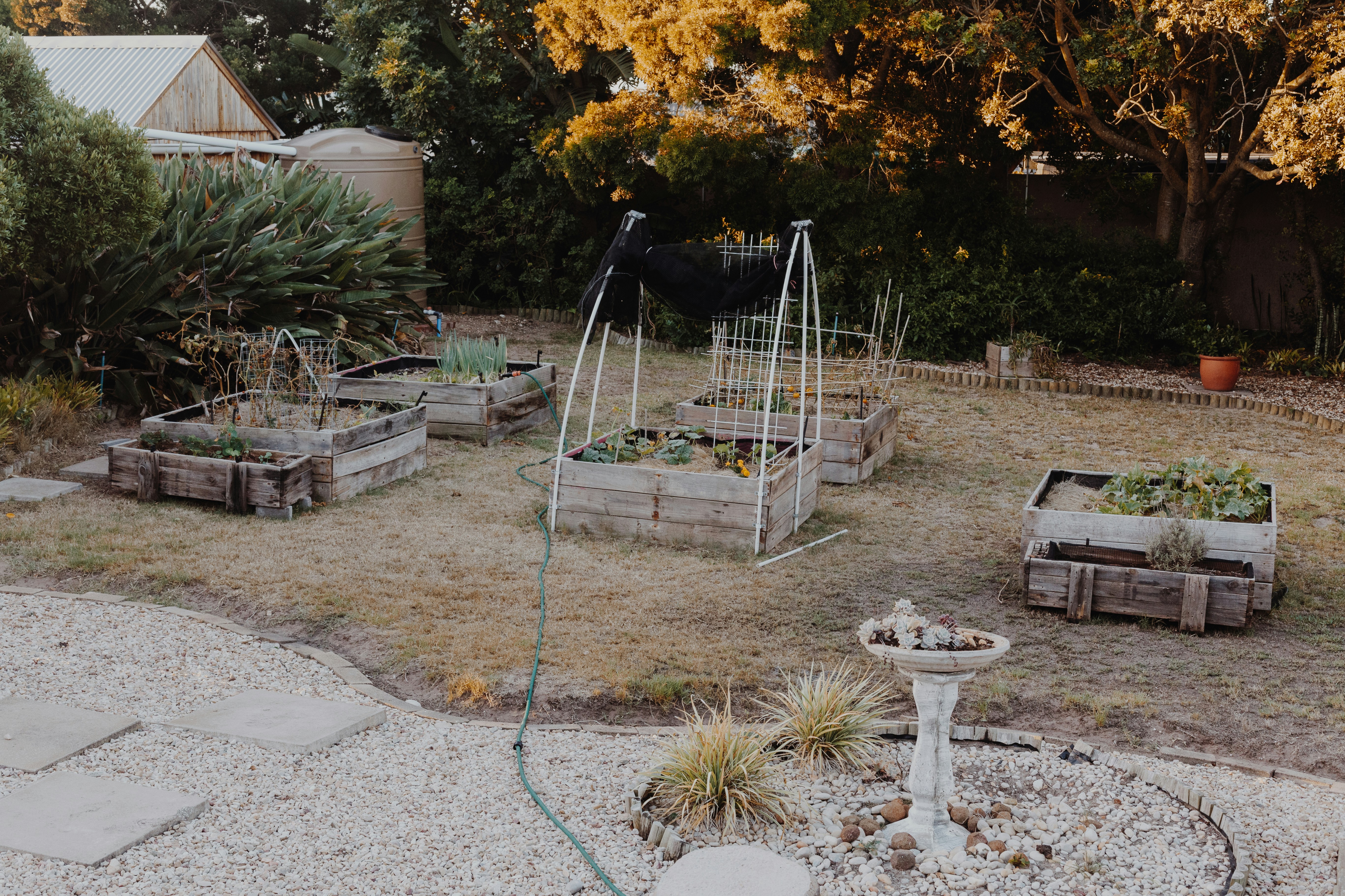 White metal stand near green grass during daytime