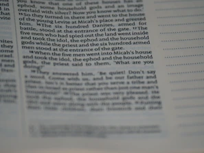 Close-up of a detailed home inspection report showing annotated photos and notes