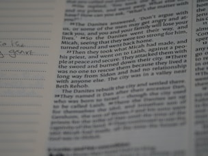 A close-up of an open book with handwritten notes.