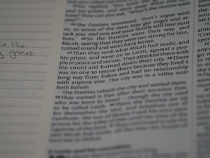 A close-up of an open book with handwritten notes.
