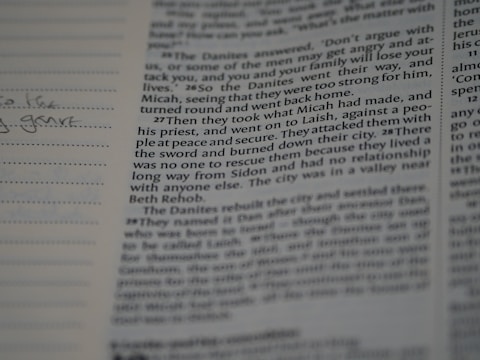 A close-up of an open book with handwritten notes.