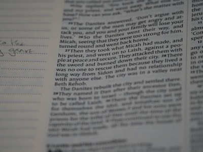 A close-up of an open book with handwritten notes.