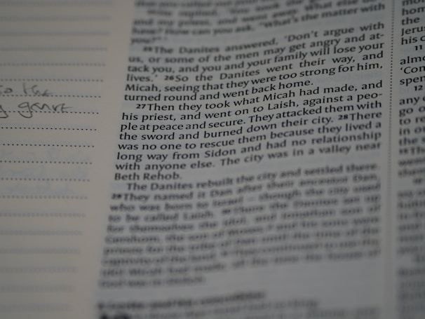 A close-up of an open book with handwritten notes.