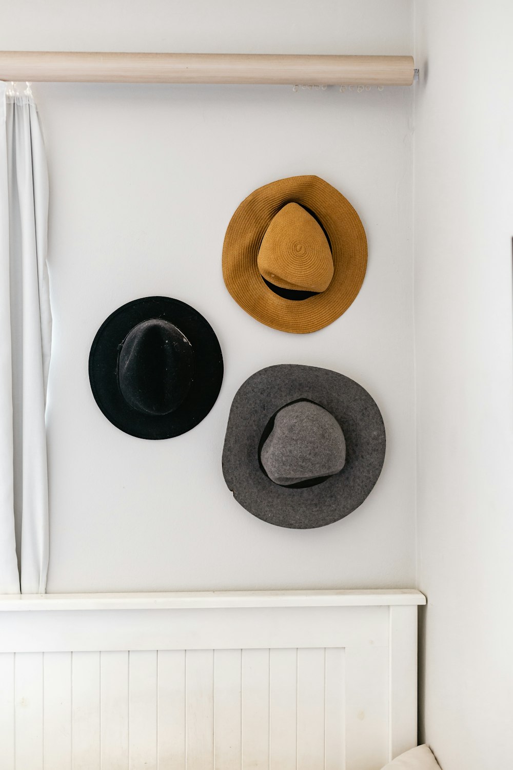 brown fedora hat on white table