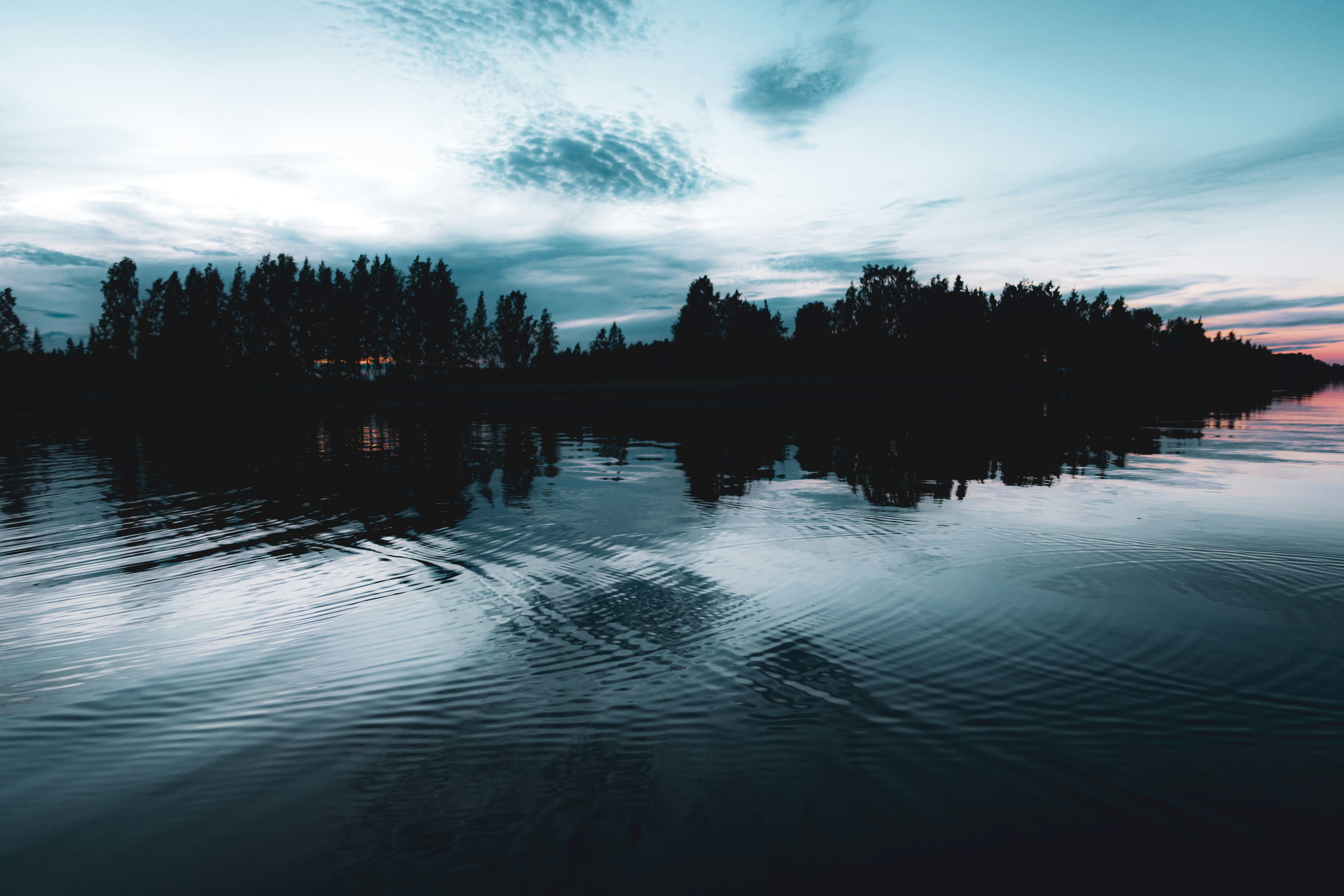 Body of water under cloudy sky