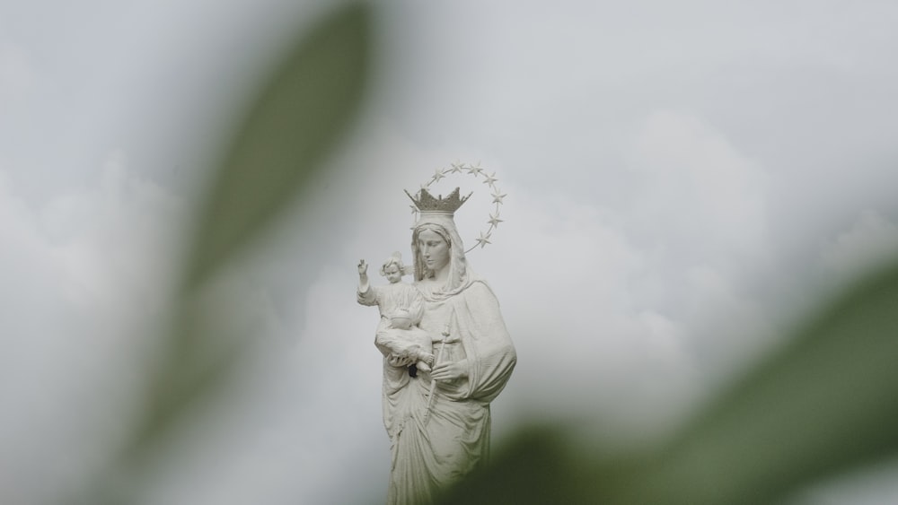 angel holding a flower statue