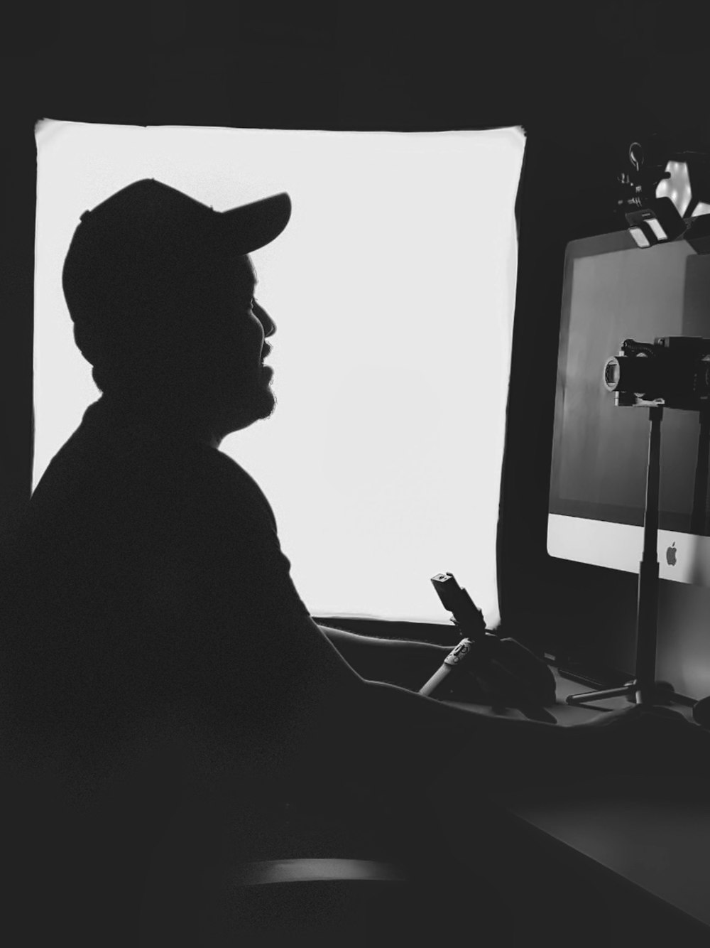 silhouette of man wearing cowboy hat